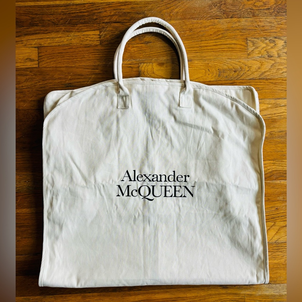 Alexander McQueen garment bag NEW!! Measures 44” x 24” width. Authentic!!
